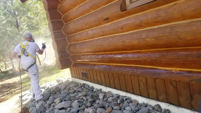 Log Home Being Refinished By Nikolas Hafstein of Copper Mountain Painting